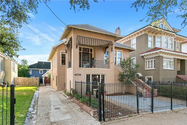 view of front of property with a balcony