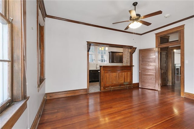 unfurnished living room featuring ceiling fan, crown molding, and hardwood / wood-style floors