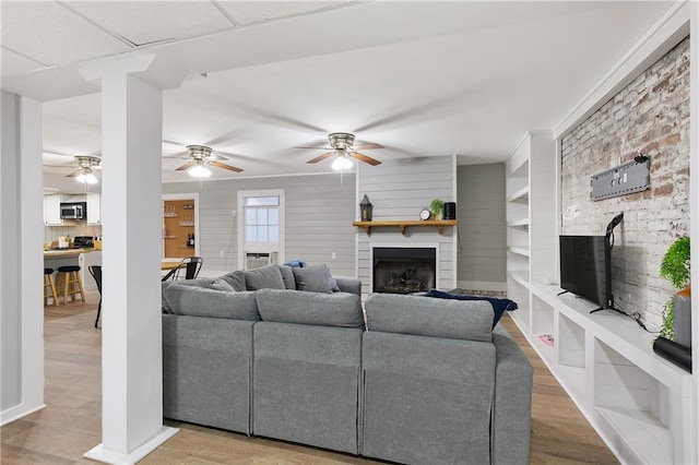 living room featuring light hardwood / wood-style flooring and a fireplace