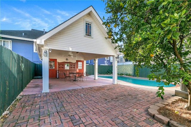 view of swimming pool with a patio area and ceiling fan