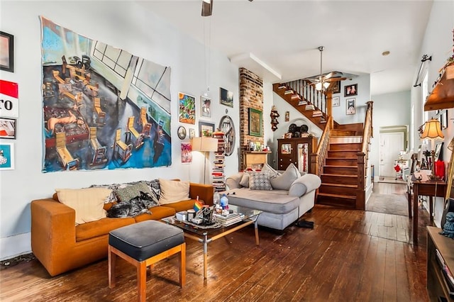 living room featuring ceiling fan and dark hardwood / wood-style floors