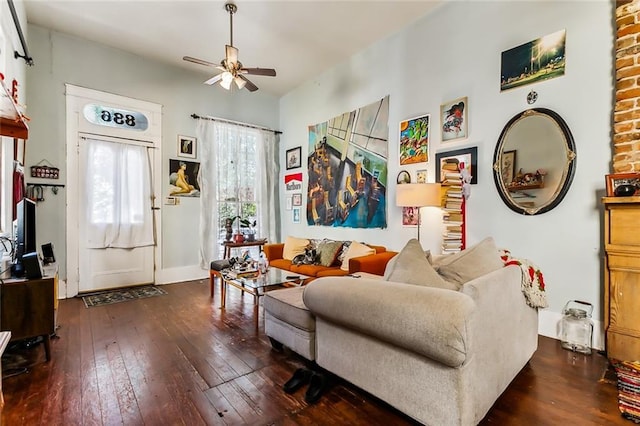 living room with ceiling fan and hardwood / wood-style floors