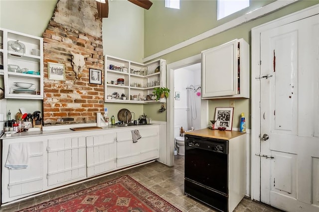 kitchen with dishwasher, ceiling fan, and white cabinetry