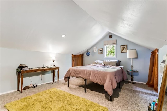 carpeted bedroom featuring lofted ceiling