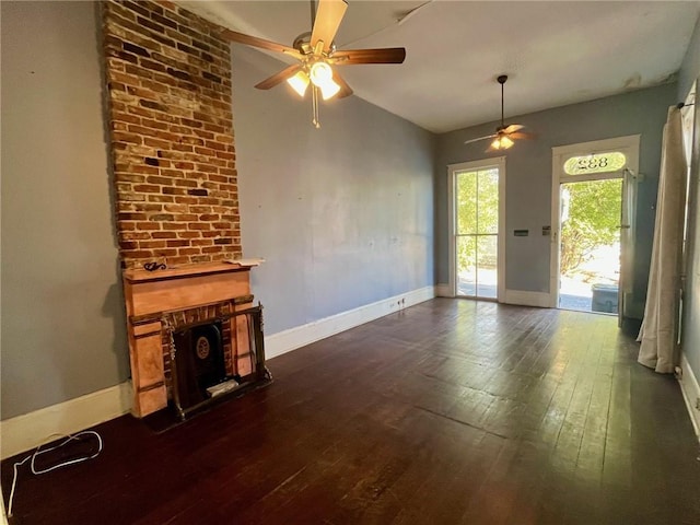 unfurnished living room with ceiling fan, dark hardwood / wood-style flooring, and lofted ceiling