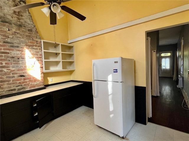 kitchen featuring ceiling fan, white fridge, and light wood-type flooring