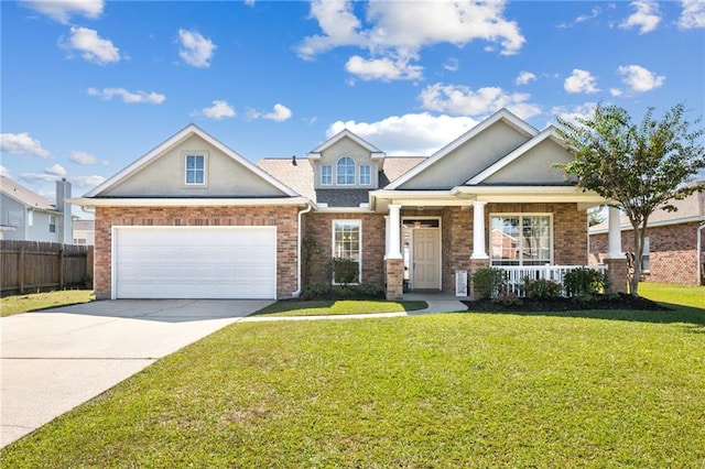 craftsman house with a porch, a front lawn, and a garage