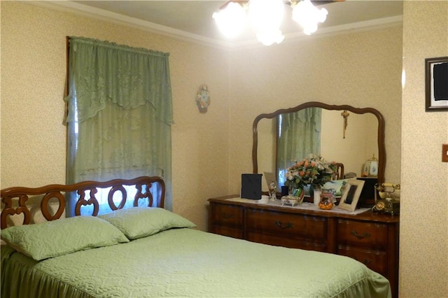 bedroom featuring crown molding and a notable chandelier