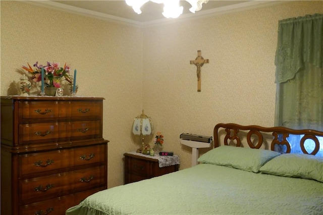 bedroom featuring crown molding