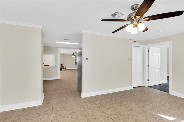 unfurnished room with light tile patterned flooring, ceiling fan, and crown molding