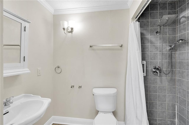 bathroom with walk in shower, crown molding, sink, and toilet