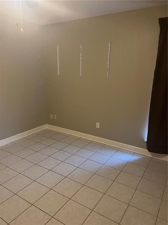 empty room with light tile patterned flooring