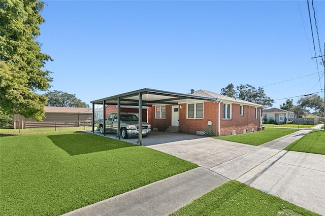 view of front of property with a carport and a front yard