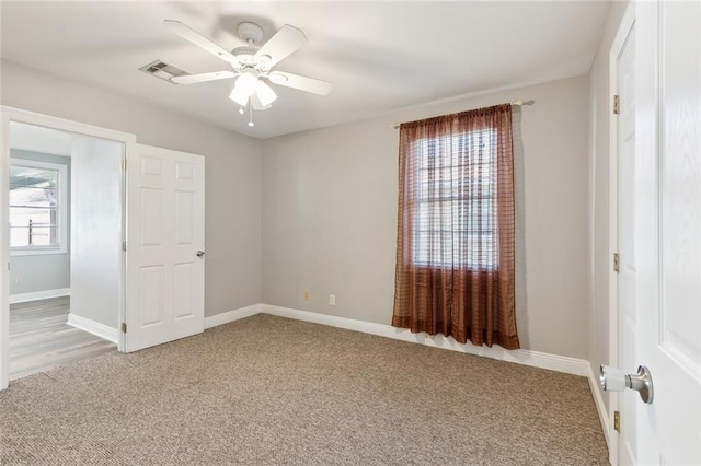 unfurnished bedroom with carpet floors and ceiling fan