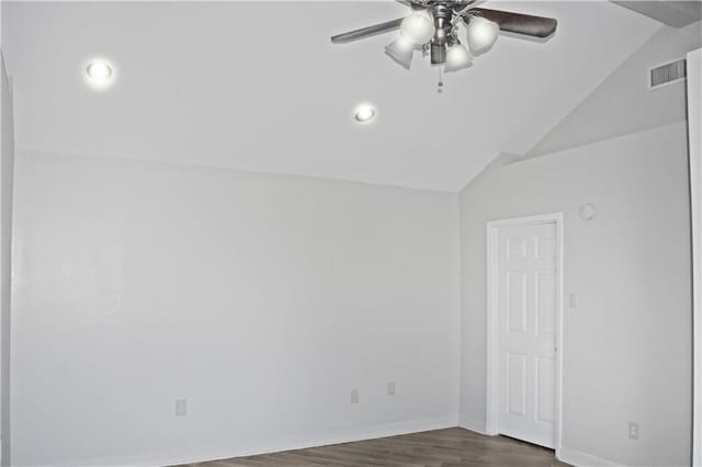 spare room featuring vaulted ceiling, dark hardwood / wood-style floors, and ceiling fan