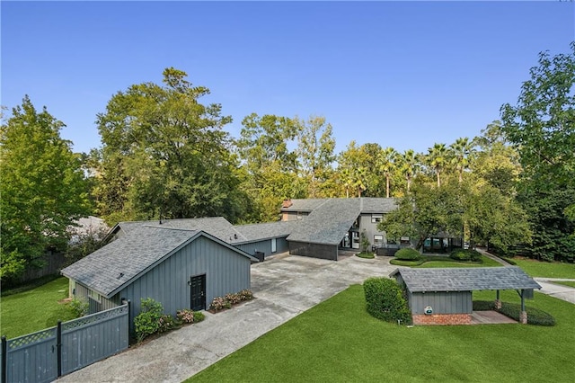 exterior space with a garage and a front lawn