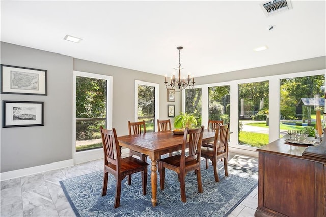 dining space with a notable chandelier