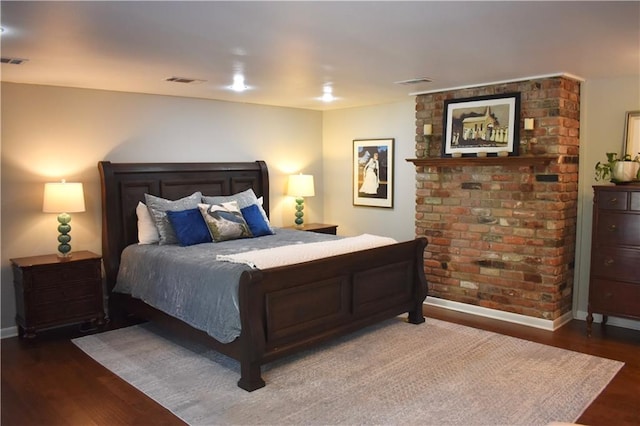 bedroom with dark wood-type flooring