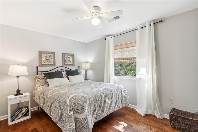 bedroom featuring dark hardwood / wood-style flooring and ceiling fan