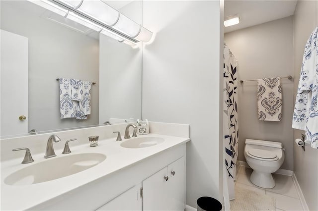 bathroom featuring toilet, curtained shower, vanity, and tile patterned floors