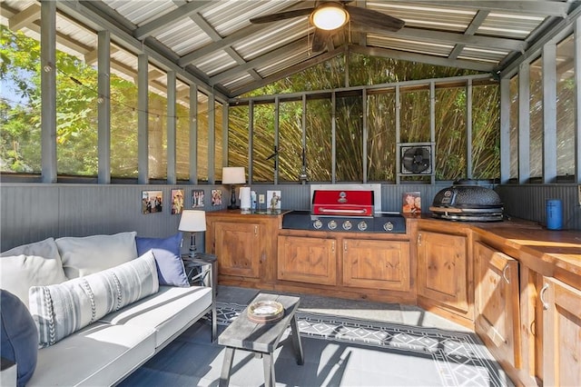 sunroom / solarium with vaulted ceiling with beams and ceiling fan