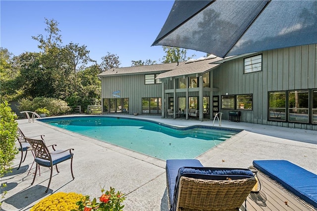 view of swimming pool featuring a patio