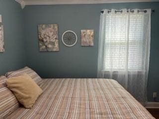 bedroom with crown molding