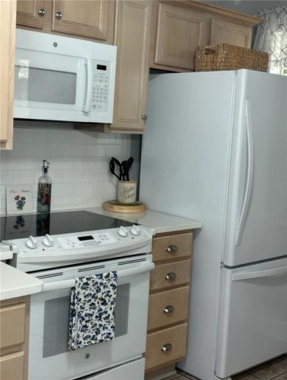 kitchen featuring white appliances and decorative backsplash