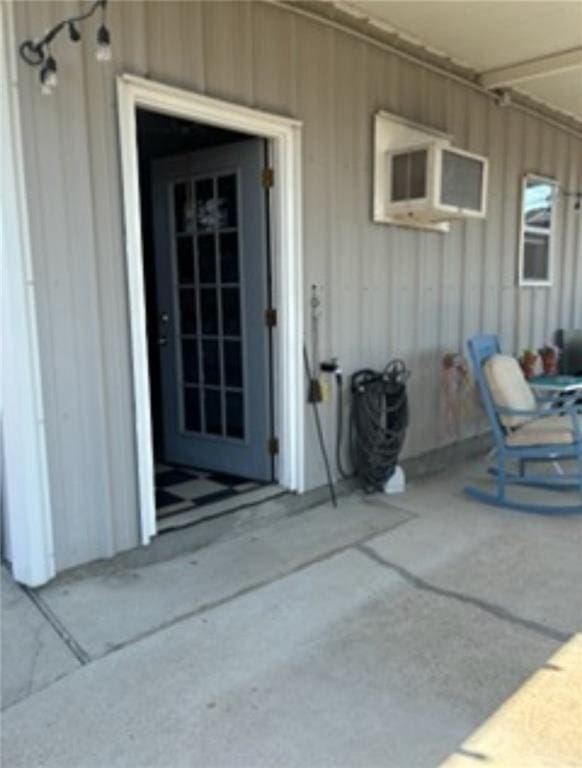 property entrance featuring a patio area