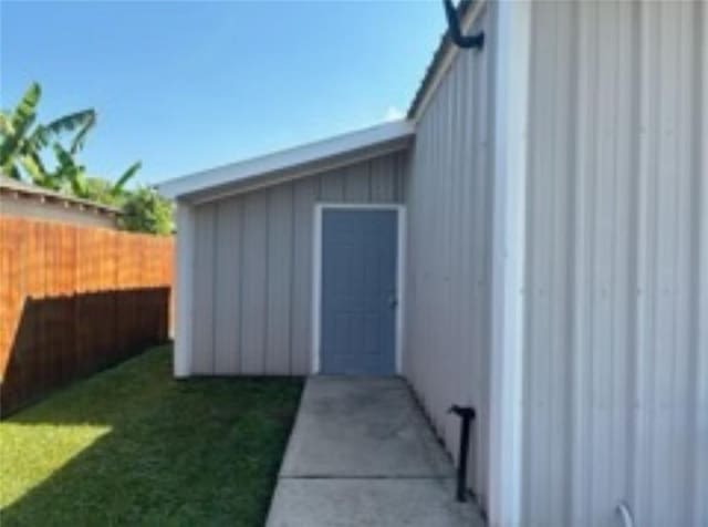 view of outbuilding featuring a yard