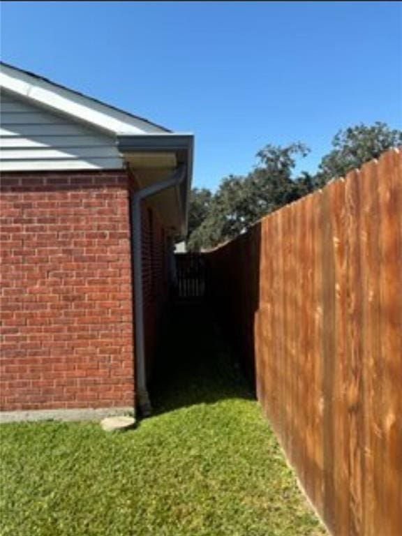 view of property exterior with a yard