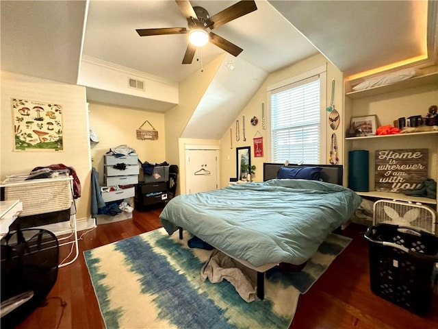 bedroom with dark wood-type flooring, ceiling fan, and lofted ceiling