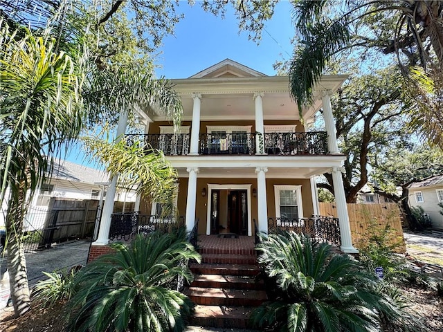 view of front facade with a porch and a balcony