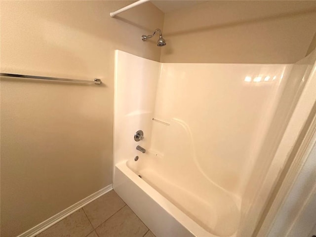 bathroom with tile patterned flooring and shower / washtub combination