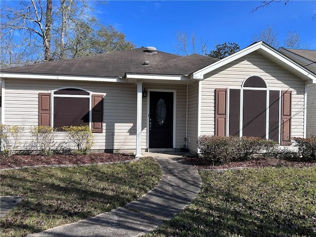 view of front of home with a front lawn