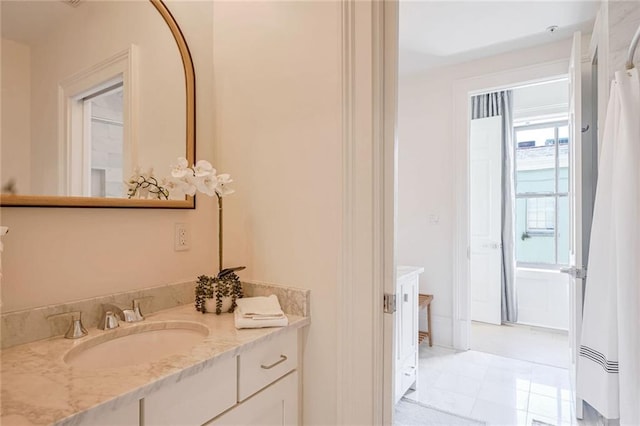 bathroom with vanity and tile patterned floors