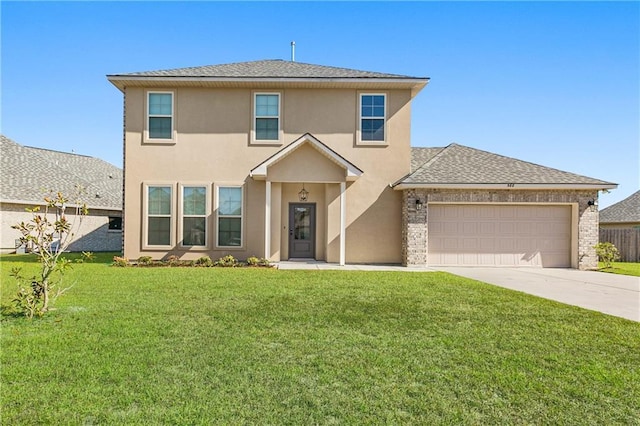 view of front facade with a front yard and a garage