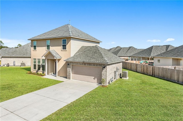 exterior space with a front yard, central AC, and a garage