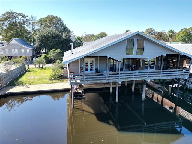 20442 Johnson Dr, Springfield, LA 70462 - dock area with a lawn and a deck with water view