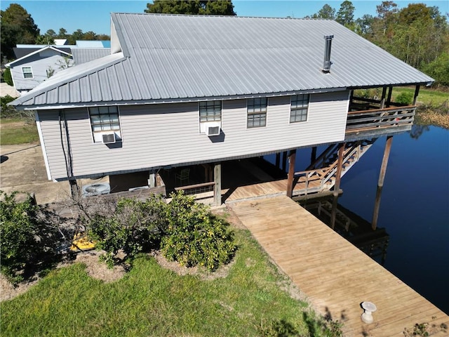 20442 Johnson Dr, Springfield, LA 70462 - rear view of property with a water view, cooling unit, and metal roof