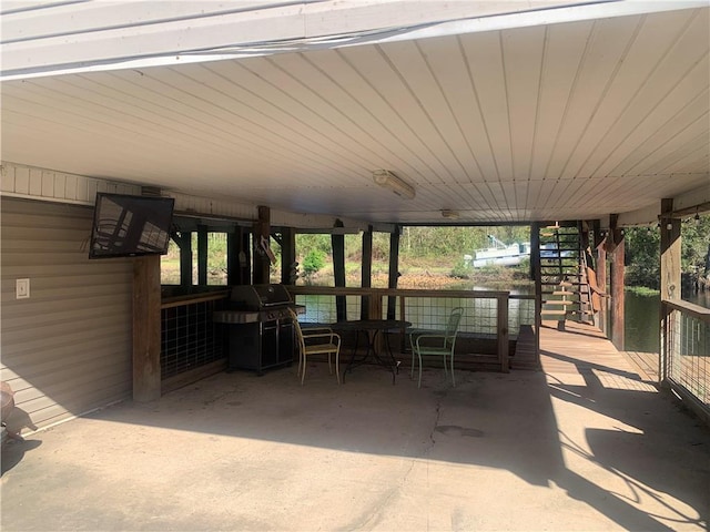 20442 Johnson Dr, Springfield, LA 70462 - view of patio featuring stairs and a grill