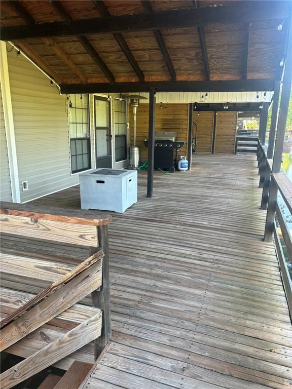 20442 Johnson Dr, Springfield, LA 70462 - wooden deck featuring a grill
