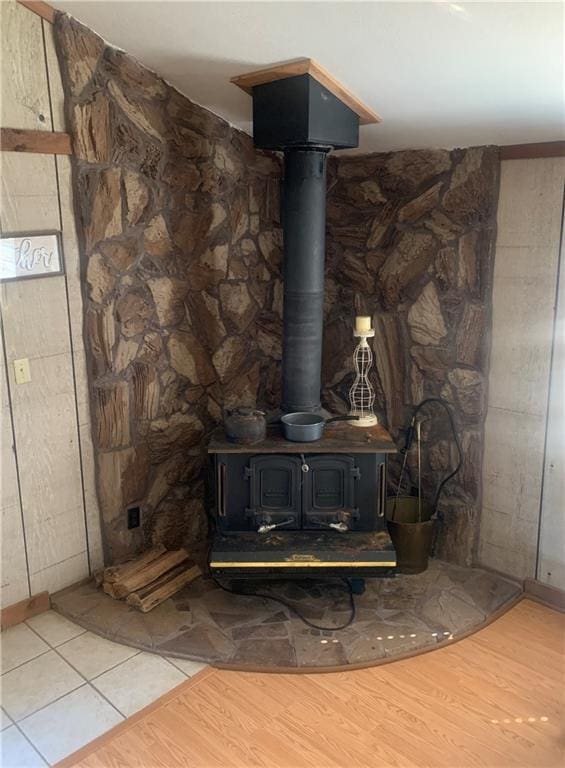 20442 Johnson Dr, Springfield, LA 70462 - interior details with a wood stove and wood finished floors