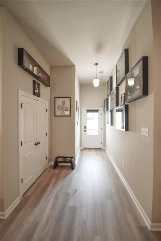 doorway to outside with dark hardwood / wood-style floors