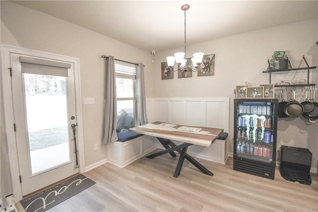 dining area with a chandelier and light wood-type flooring