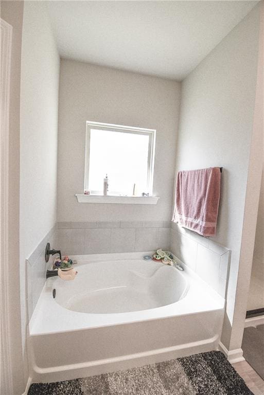 bathroom featuring a washtub