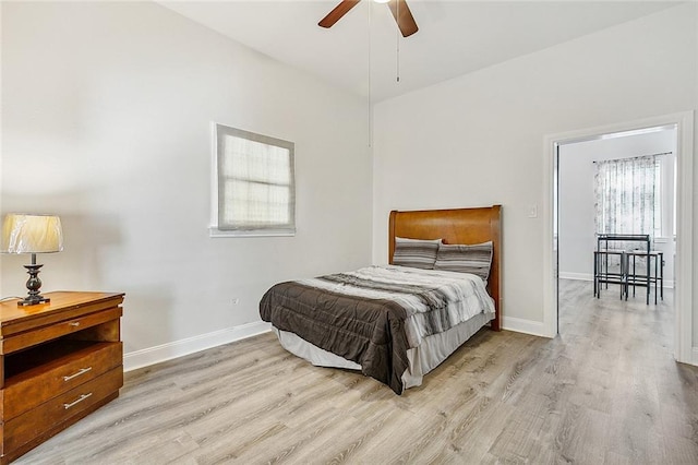 bedroom with ceiling fan and light wood-type flooring