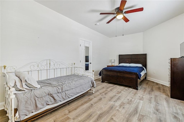 bedroom featuring ceiling fan and light hardwood / wood-style flooring