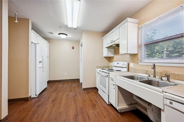 kitchen with white cabinets, sink, dark wood-type flooring, and white appliances