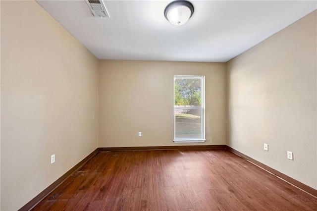 empty room featuring dark hardwood / wood-style floors